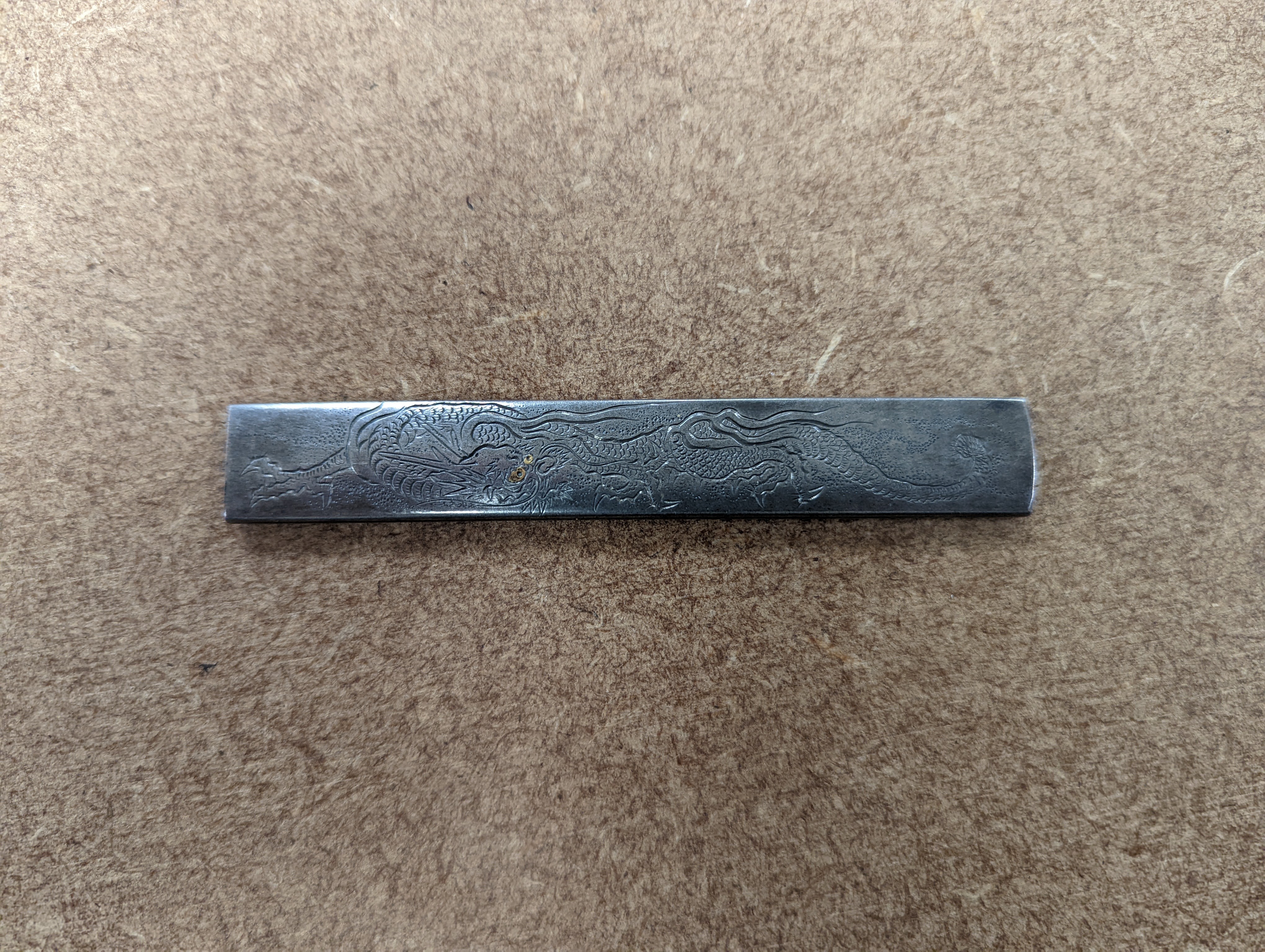 A Japanese mixed metal ‘dragon’ kozuka handle, 19th century, boxed
